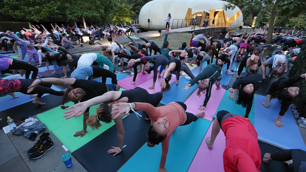 Lululemon Athletica hosts a mass yoga class at the Serpentine Pavilion, Hyde Park, London as a celebration of summer