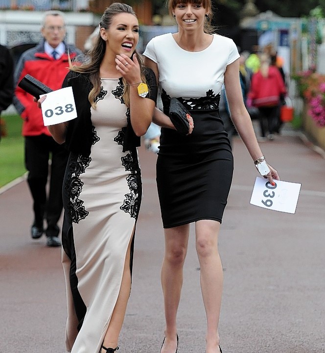 Racegoers arrive for Ladies Day during Day Two of the 2014 Welcome To Yorkshire Ebor Festival at York Racecourse, York