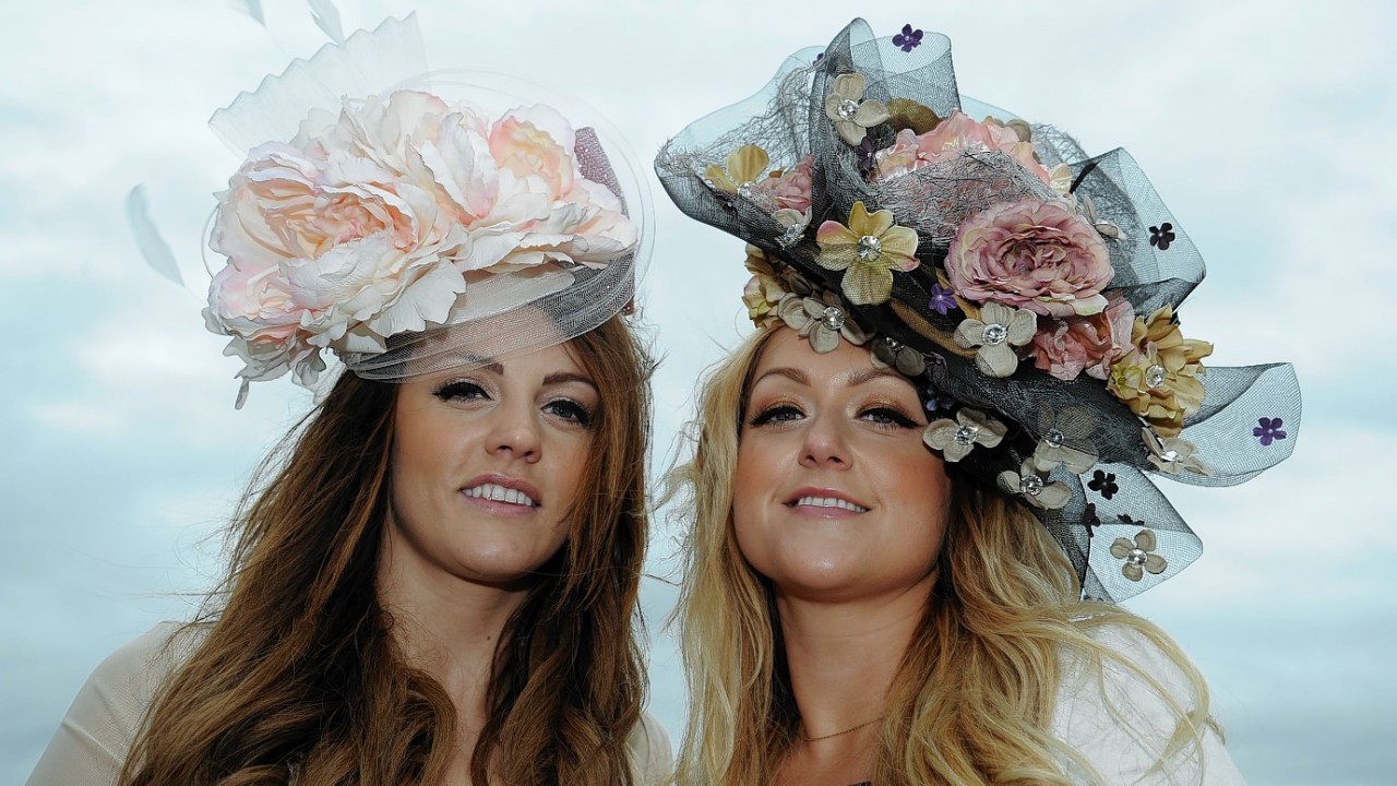 Racegoers arrive for Ladies Day during Day Two of the 2014 Welcome To Yorkshire Ebor Festival at York Racecourse, York