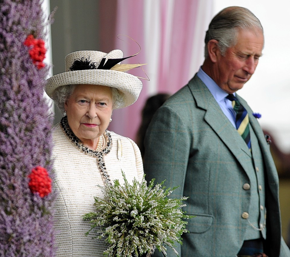 The Queen and Prince Charles attend the Braemar Gathering. Credit:  Kami Thomson.