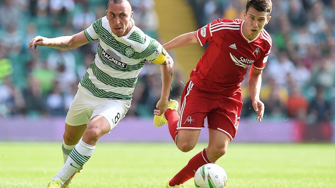 Scott Brown and Ryan Jack challenge for the ball