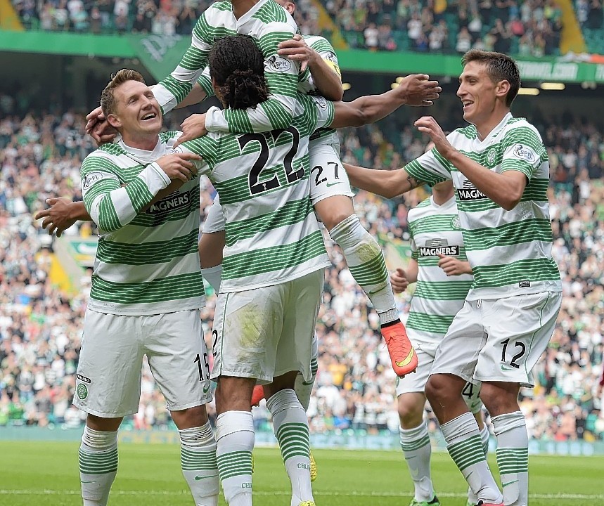 Celtic players mob Denayer after he opened the scoring