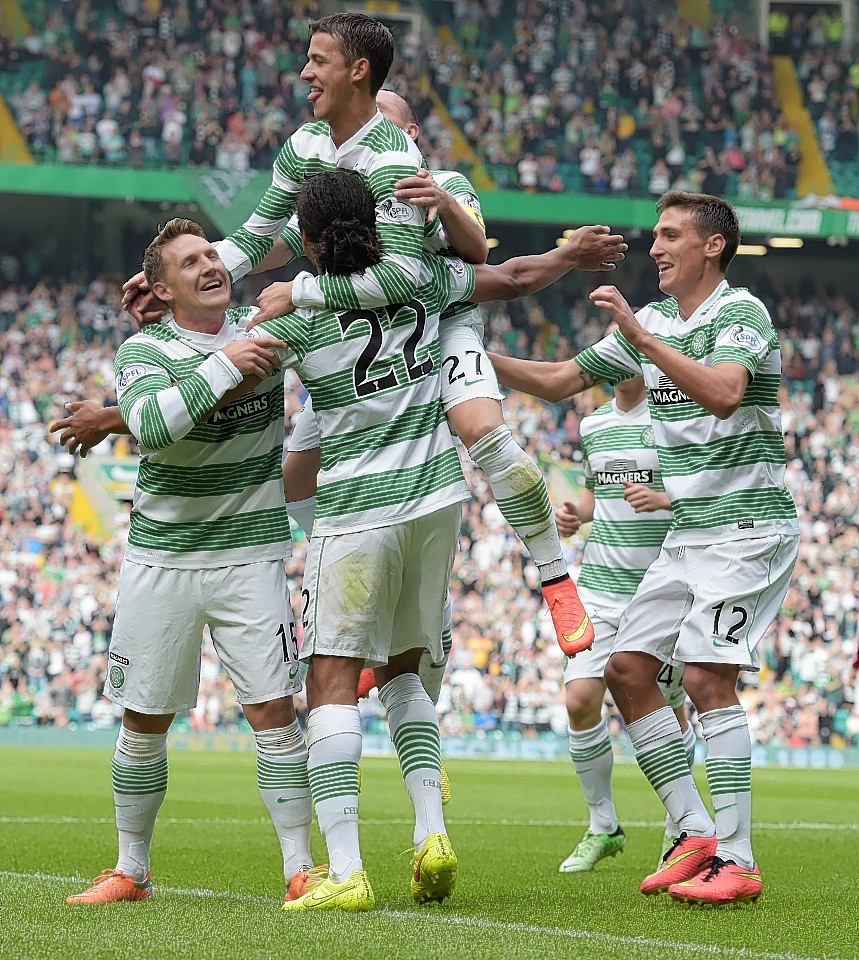 Celtic players mob Denayer after he opened the scoring