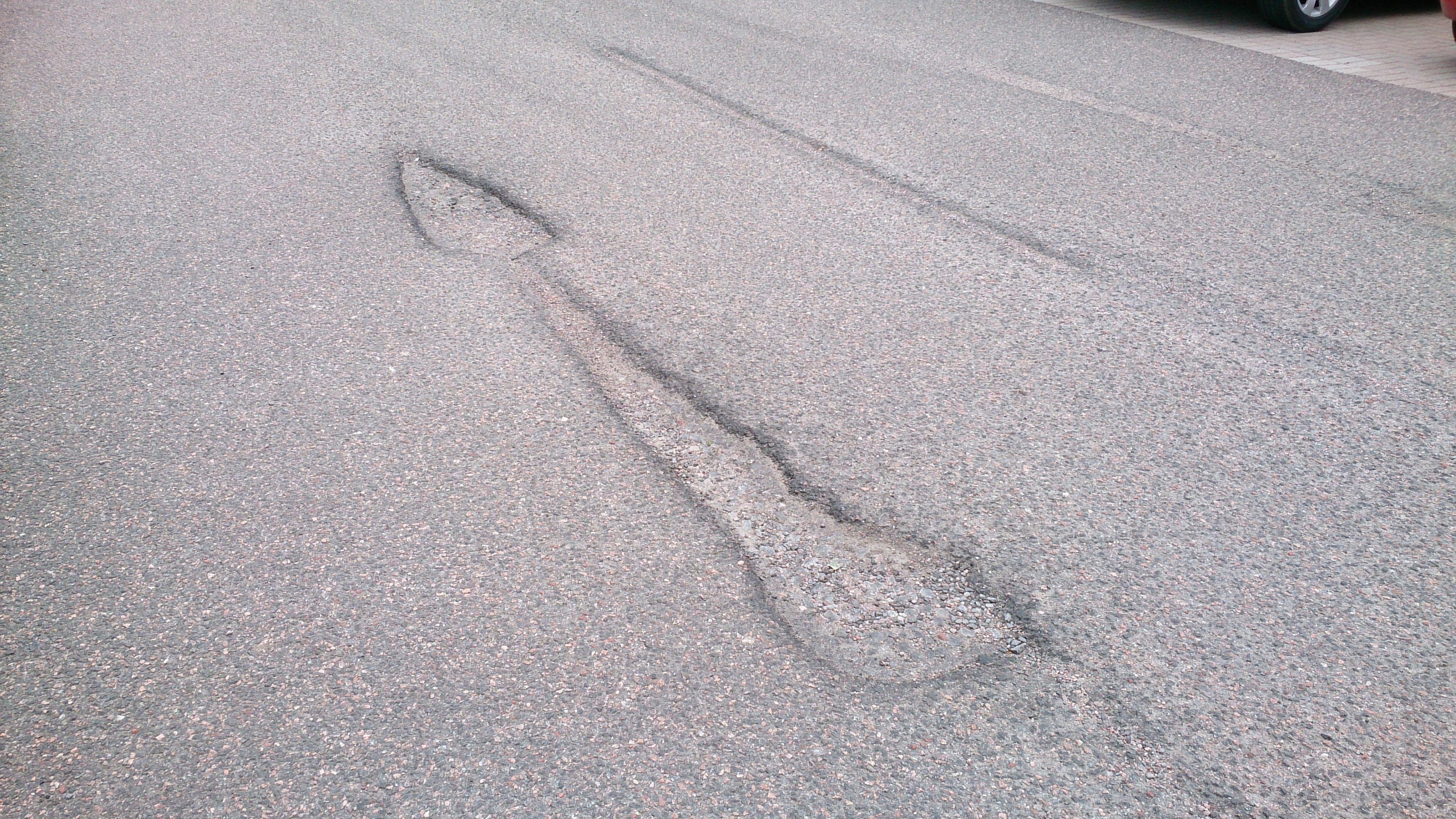 The arrow-shaped pothole at the Inshes Retail Park.