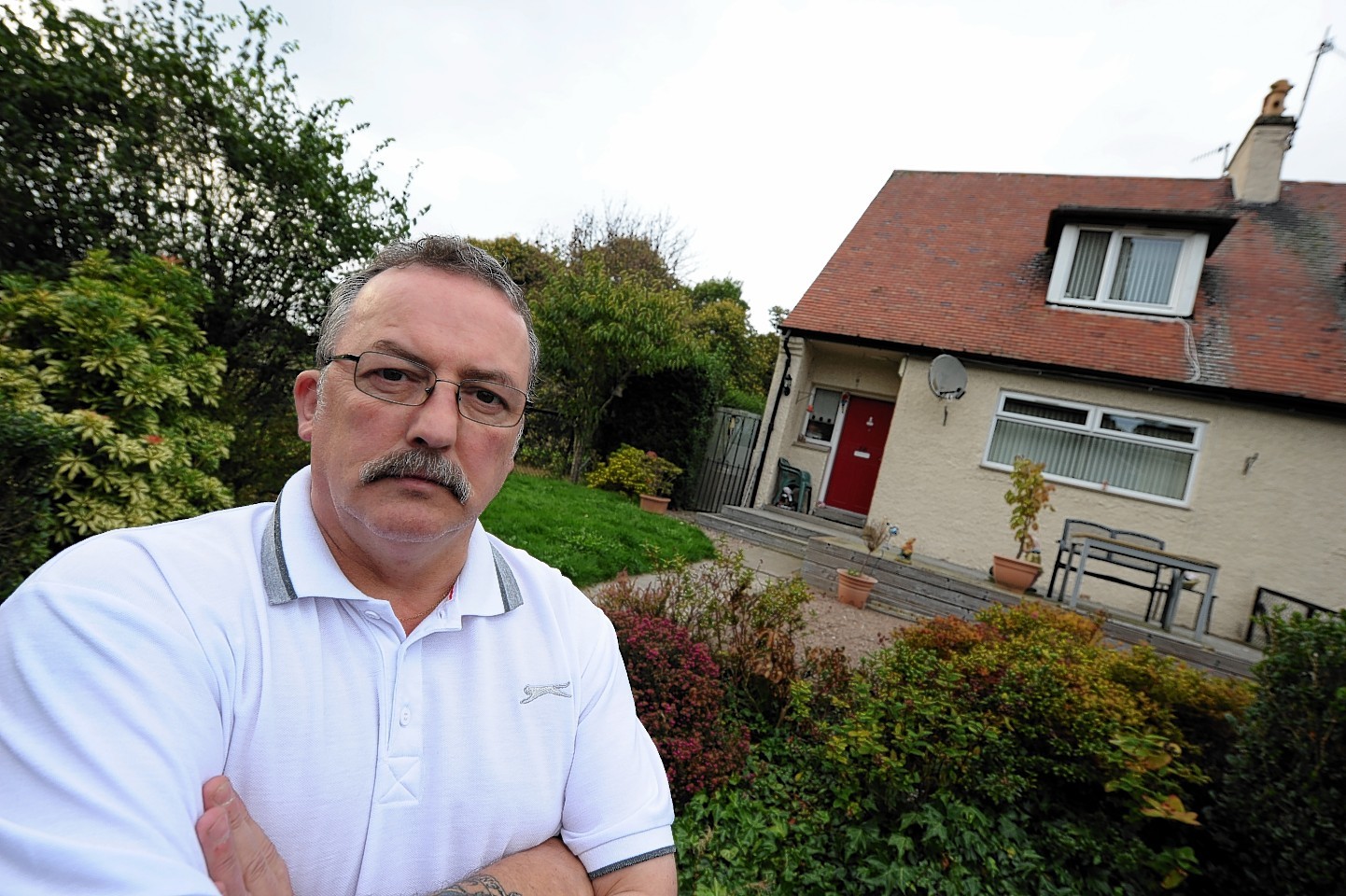 Glen Morrison outside his home