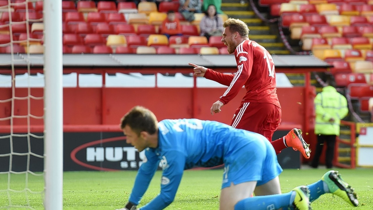 David Goodwillie wheels away to celebrate after scoring Aberdeen's second on Saturday
