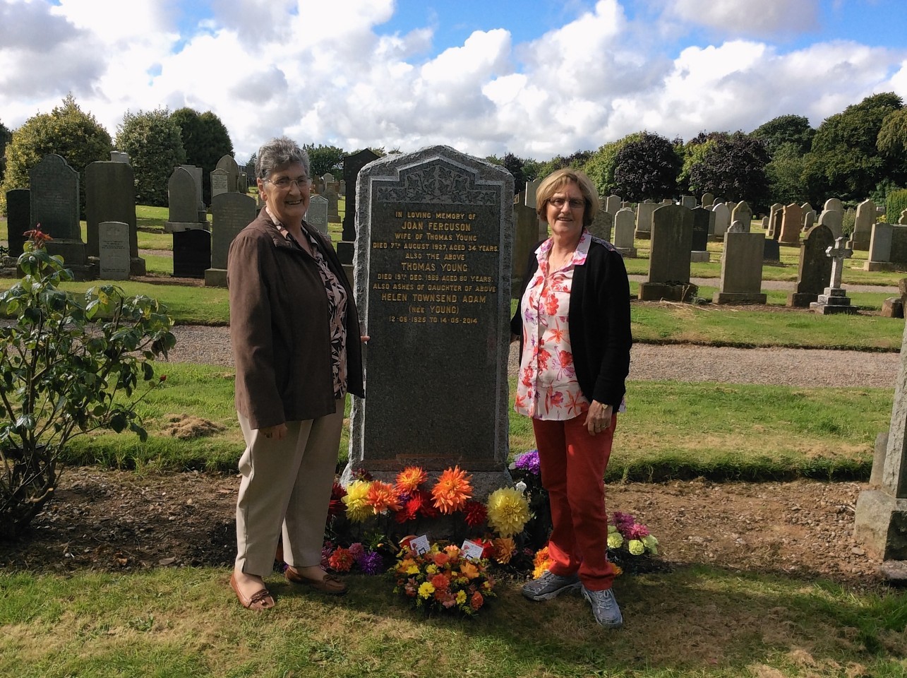 Jean MacKinnon and Linda Bruce at the grave stone of Joan Ferguson
