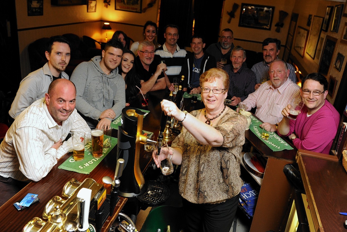 Pub-goers at the Old Mill Inn, on closing day last October. Credit: Kenny Elrick.