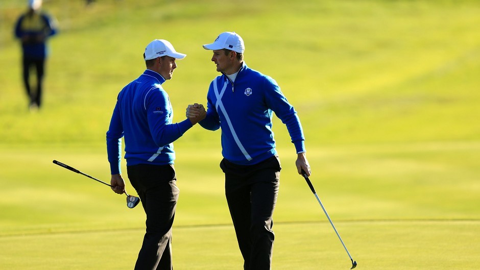 Justin Rose (right) and Henrik Stenson claimed the first point on the opening day