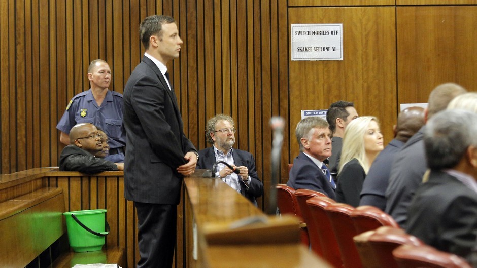 Oscar Pistorius stands in the dock in court in Pretoria, South Africa (AP)