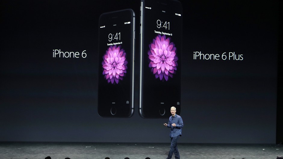 Apple CEO Tim Cook introduces the new iPhone 6 and iPhone 6 Plus (AP)