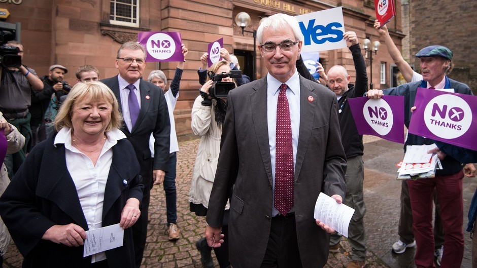 Alistair Darling with his wife Maggie (left) and No campaigners outside the polling station at the Church Hill Theatre in Edinburgh