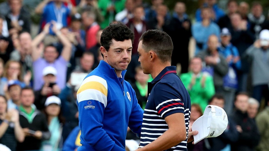 Europe's Rory McIlroy (left) shakes hands with USA's Rickie Fowler after their singles match on day three of the 40th Ryder Cup at Gleneagles