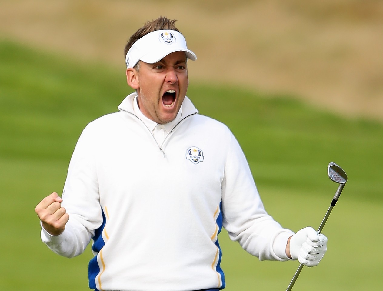 Poulter shows his delight at holing his chip on the 15th this morning