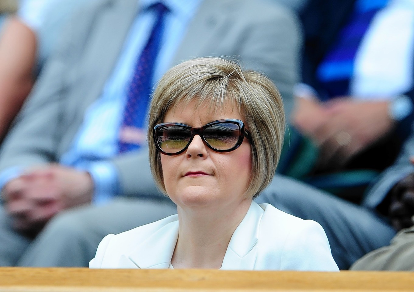 Stylish: Sturgeon is a fan of heels, shades and suits but admits she prefers lounging about in jeans