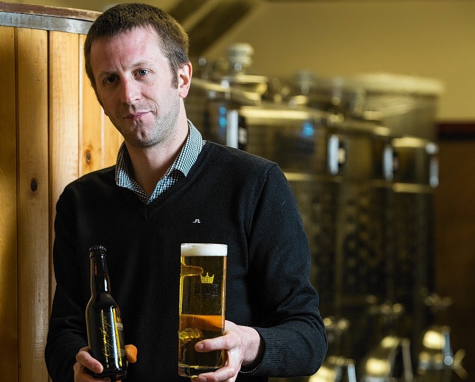 Neil Stirton, sales manager at Deeside Brewery, with a bottle of Craft Lager