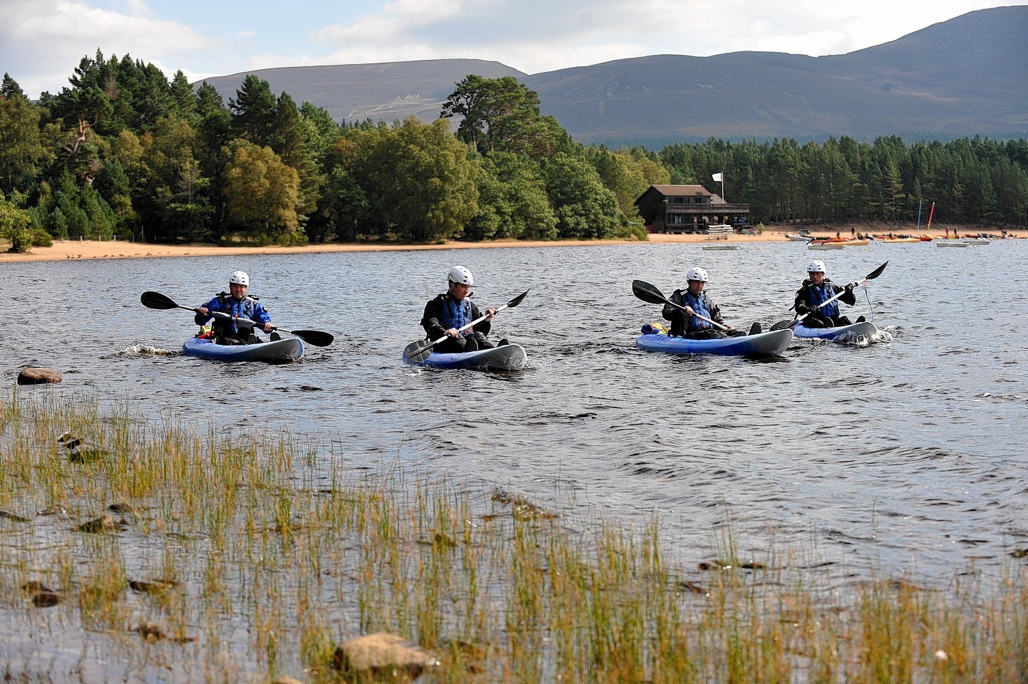 Police canoeists search the loch for clues