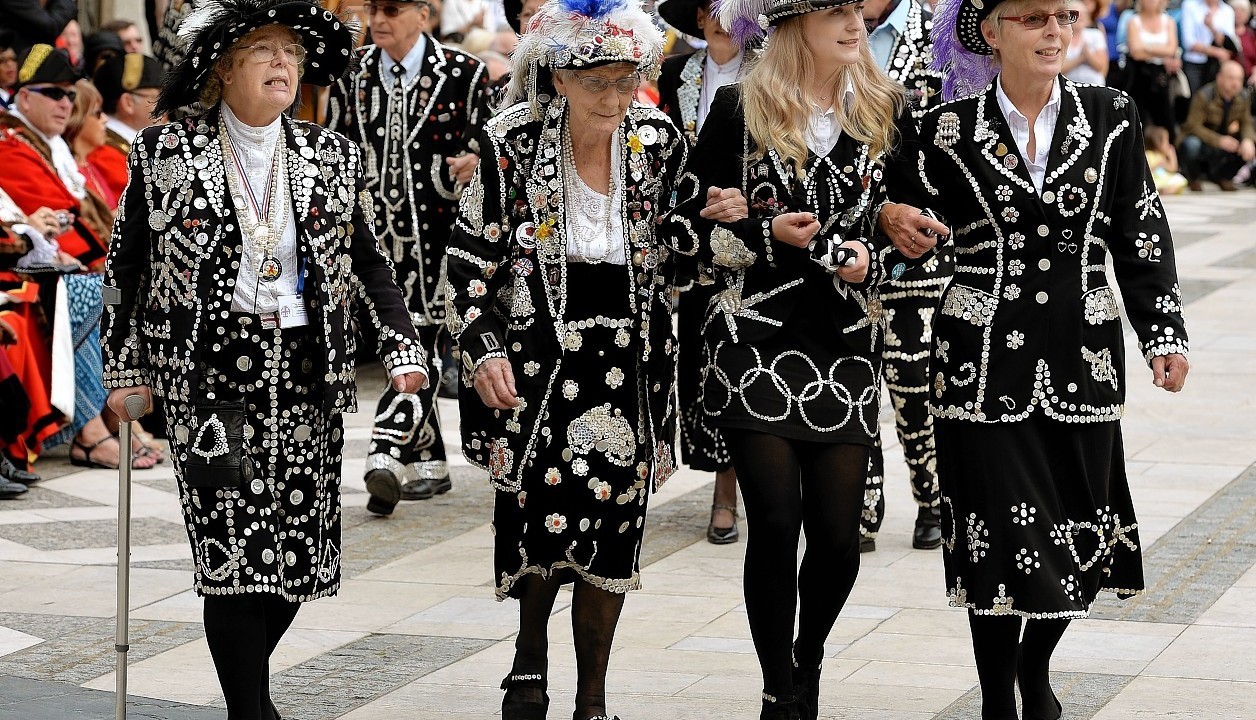 The Pearly Kings and Queens gather at the Guildhall Square as they parade to St Mary-le-Bow church to celebrate the harvest festival