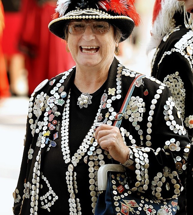 The Pearly Kings and Queens gather at the Guildhall Square as they parade to St Mary-le-Bow church to celebrate the harvest festival