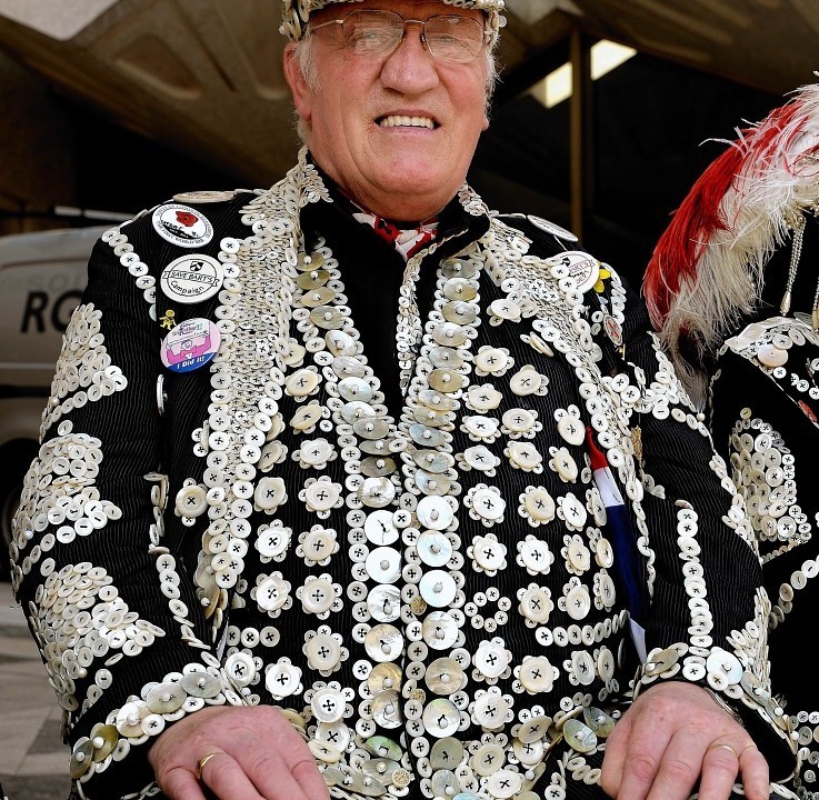 The Pearly Kings and Queens gather at the Guildhall Square as they parade to St Mary-le-Bow church to celebrate the harvest festival