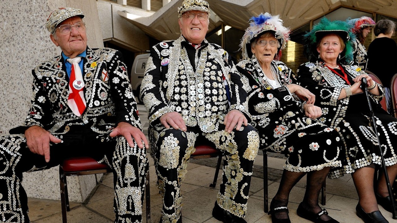 The Pearly Kings and Queens gather at the Guildhall Square as they parade to St Mary-le-Bow church to celebrate the harvest festival