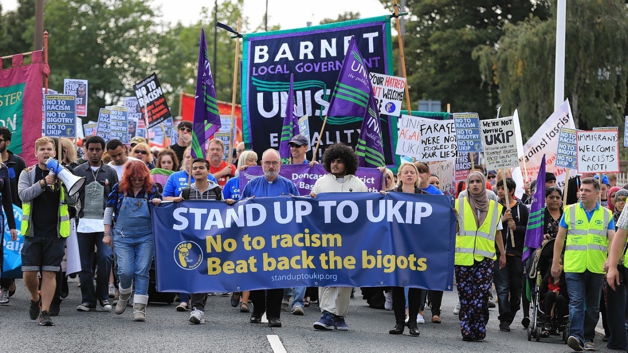 Protesters  take part in a 'Stand up to UKIP' march outside Doncaster Racecourse on the second day of the UKIP (UK Independence Party) party conference at Doncaster Racecourse on September 27, 2014