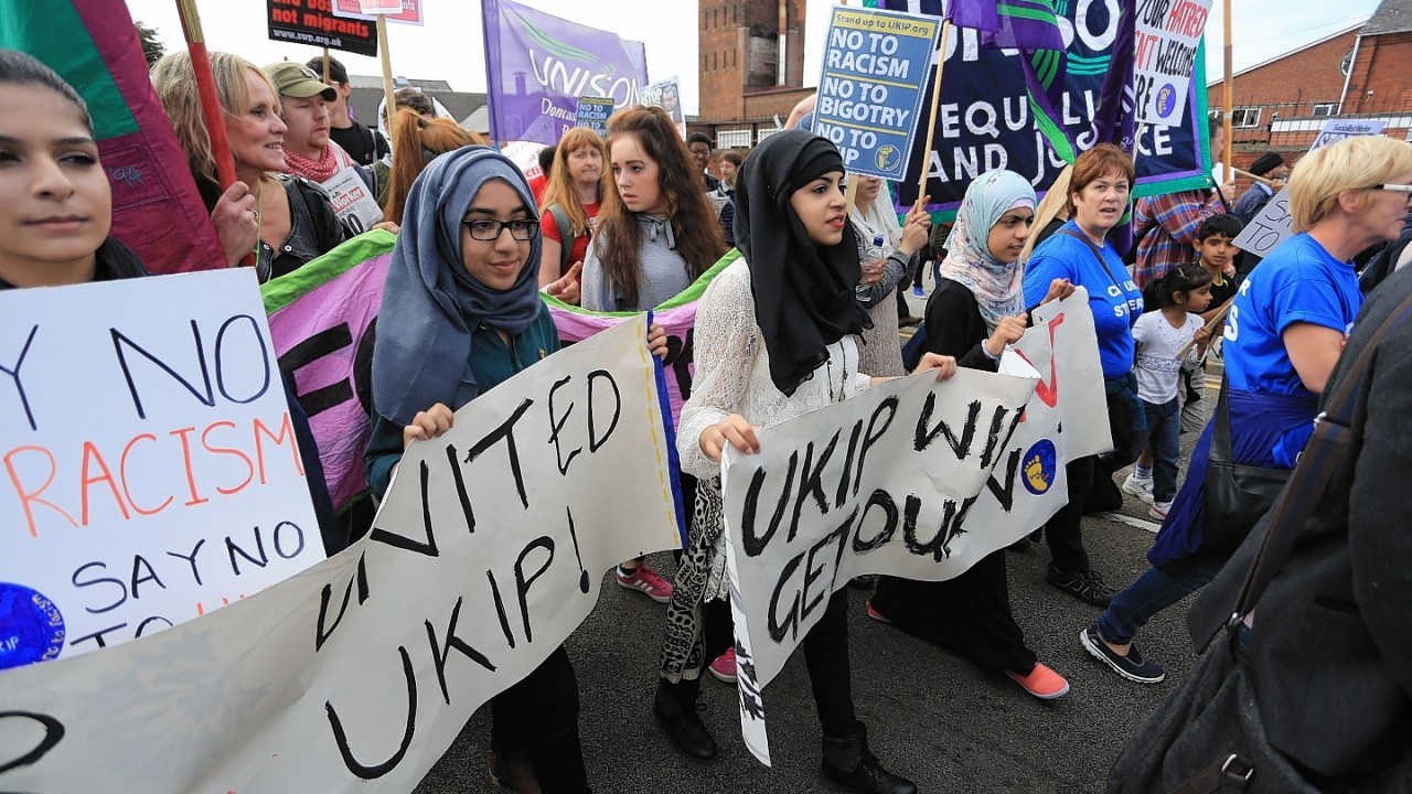 Protesters  take part in a 'Stand up to UKIP' march outside Doncaster Racecourse on the second day of the UKIP (UK Independence Party) party conference at Doncaster Racecourse on September 27, 2014