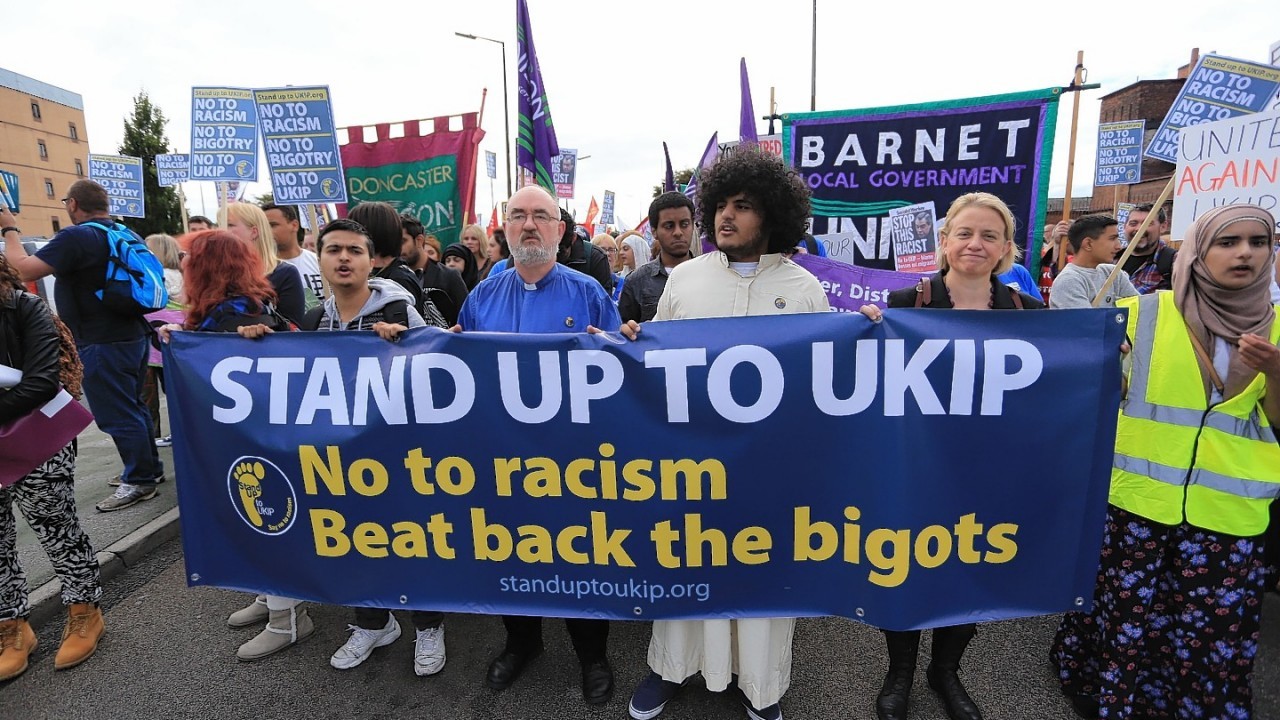 Protesters  take part in a 'Stand up to UKIP' march outside Doncaster Racecourse on the second day of the UKIP (UK Independence Party) party conference at Doncaster Racecourse on September 27, 2014