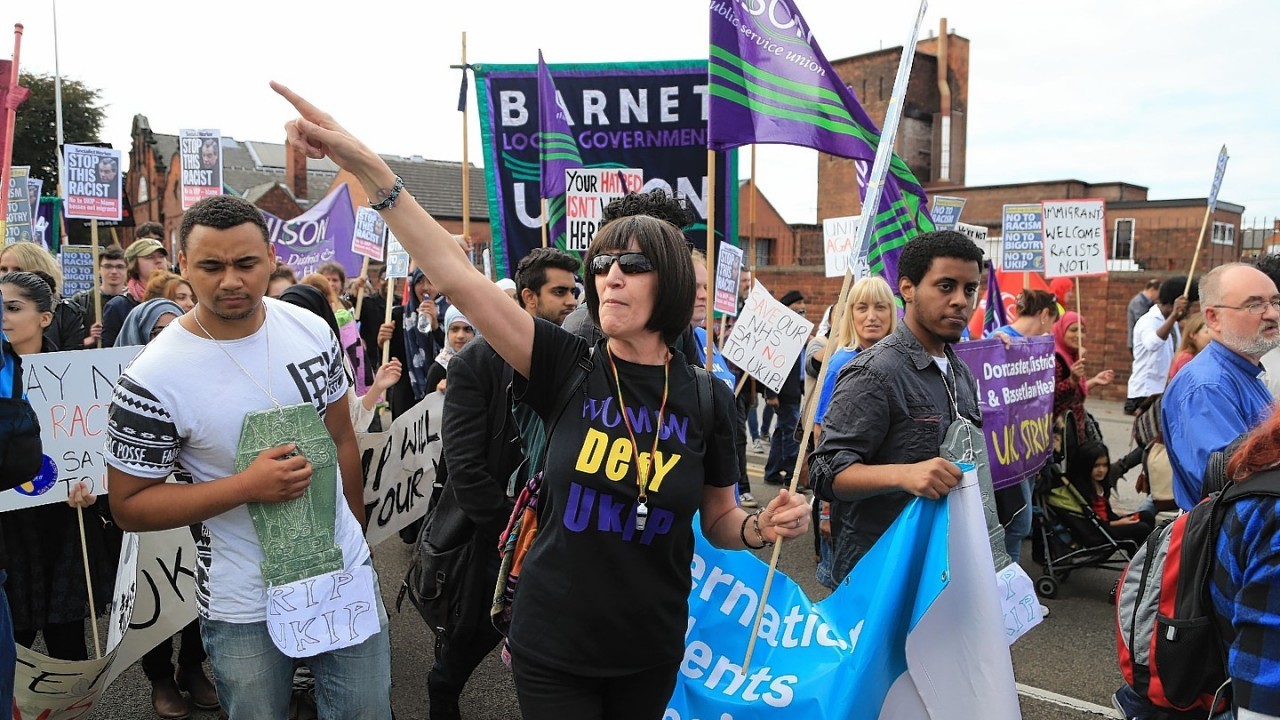 Protesters  take part in a 'Stand up to UKIP' march outside Doncaster Racecourse on the second day of the UKIP (UK Independence Party) party conference at Doncaster Racecourse on September 27, 2014