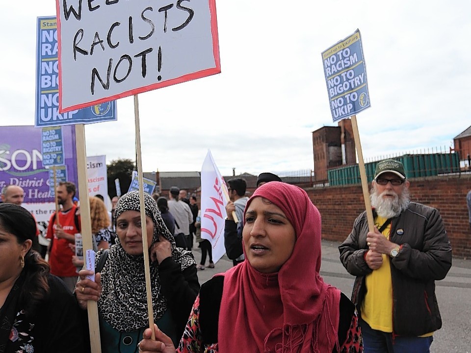 Protesters  take part in a 'Stand up to UKIP' march outside Doncaster Racecourse on the second day of the UKIP (UK Independence Party) party conference at Doncaster Racecourse on September 27, 2014