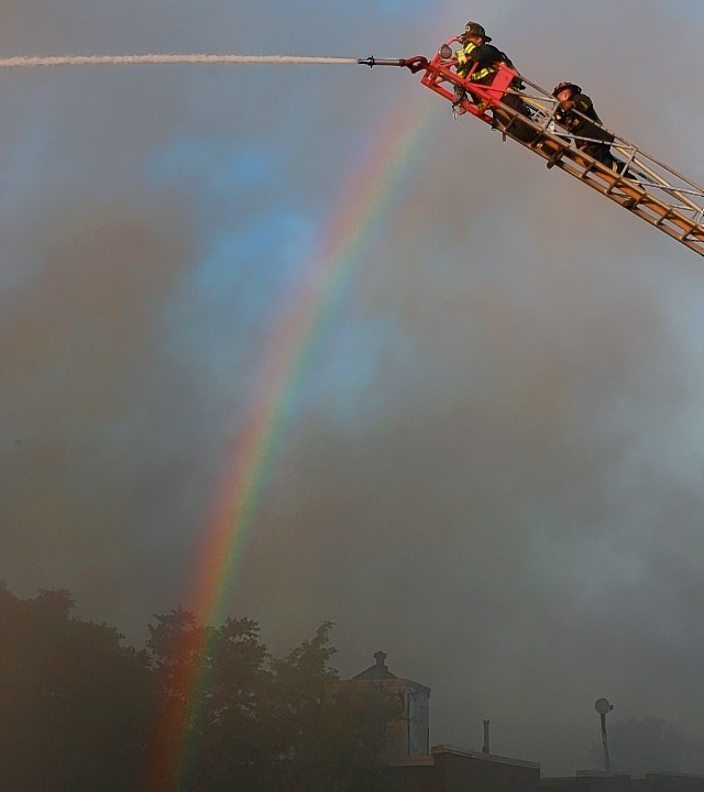 Firefighters respond to a fire on Harvard Terrace in the Allston neighborhood in Boston on Wednesday, Sept. 3, 2014