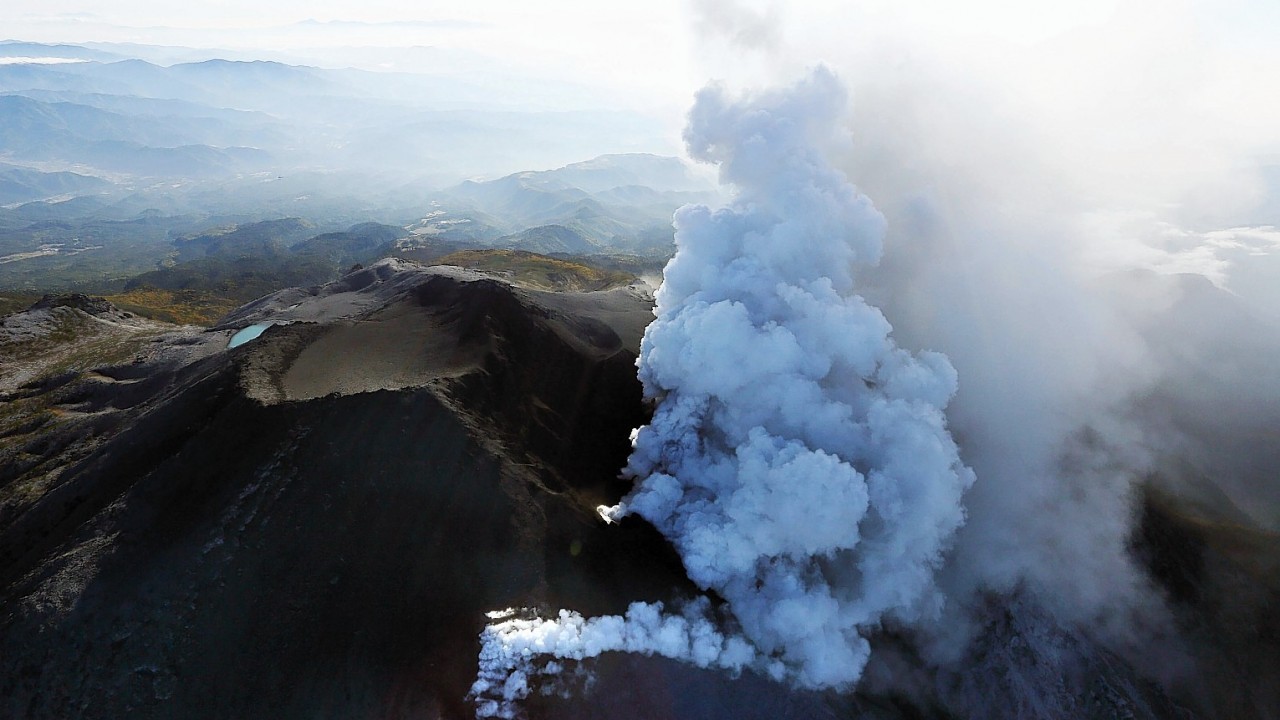 Plumes of smoke and ash billow from Mount Ontake as it continues to erupt in central Japan, Sunday, Sept. 28, 2014