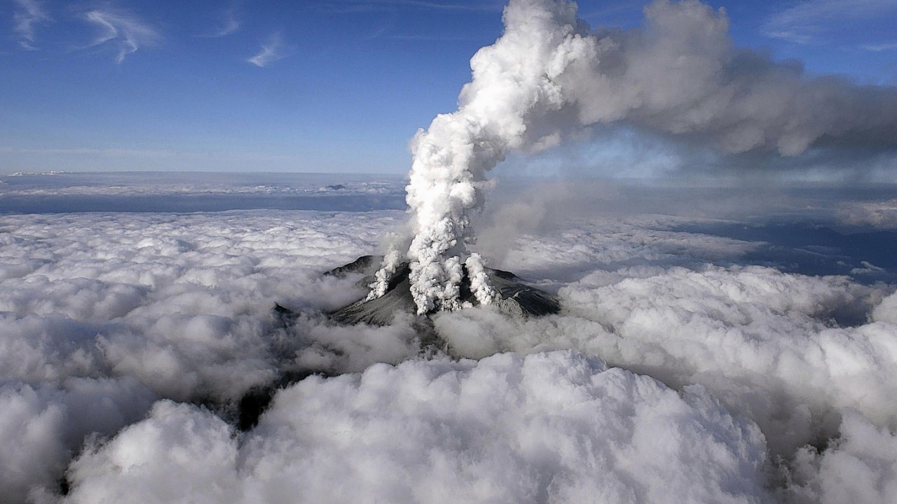 Plumes of smoke and ash billow from Mount Ontake as it continues to erupt in central Japan, Sunday, Sept. 28, 2014