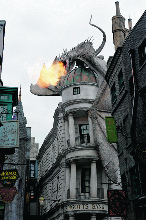 A Ukrainian Ironbelly dragon breathing fire from the top of Gringotts Bank