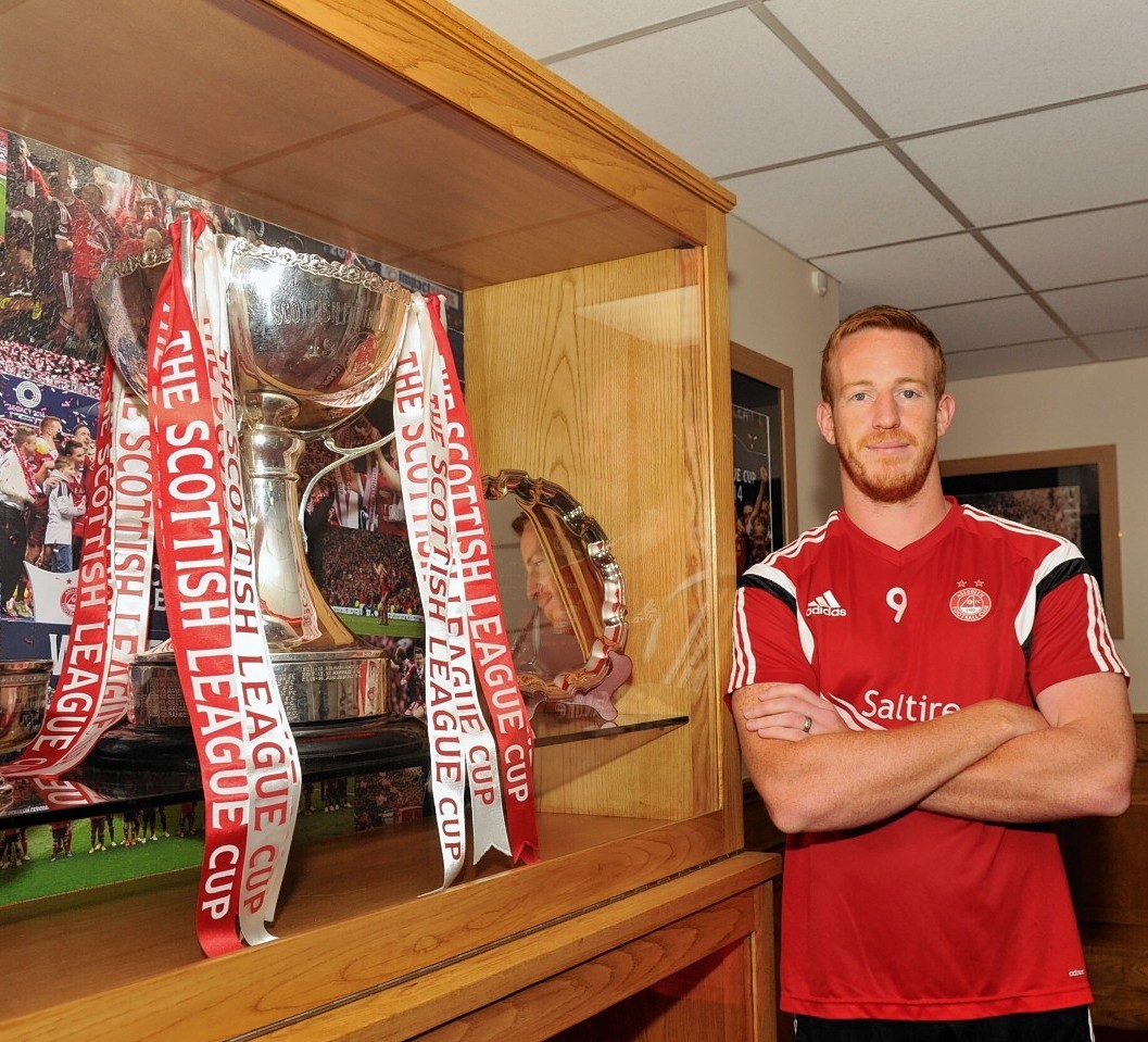 Adam Rooney hopes Aberdeen can retain the League Cup but for now they are focused on league duty against Motherwell