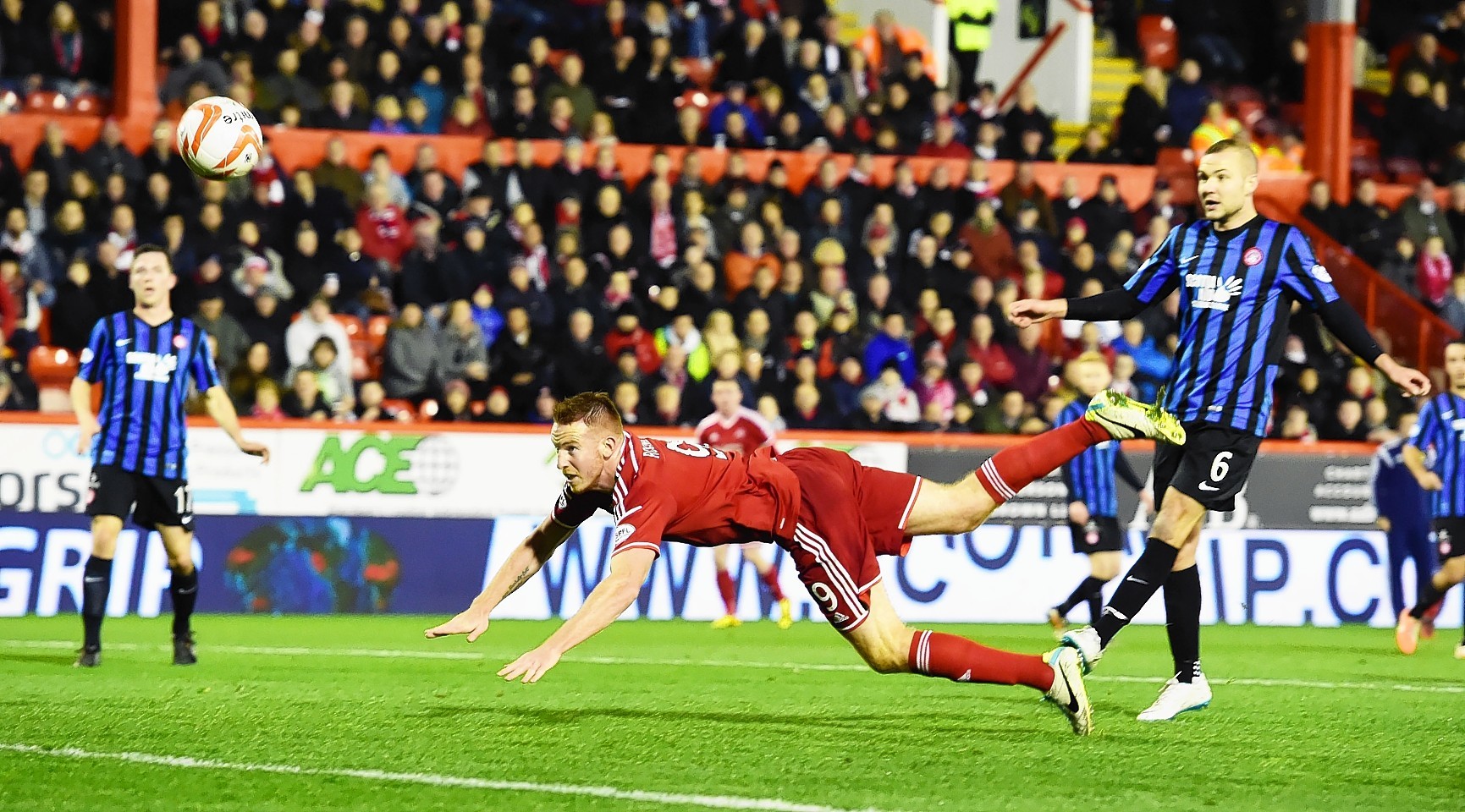 Adam Rooney dives to head home the only goal of the game.