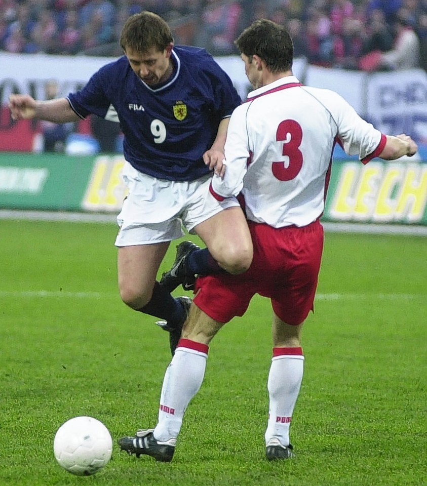 Billy Dodds up against Poland 