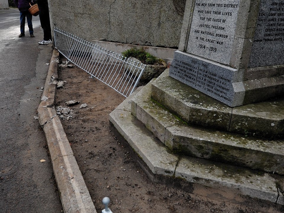 the lorry damaged this wall, railings and war memorial