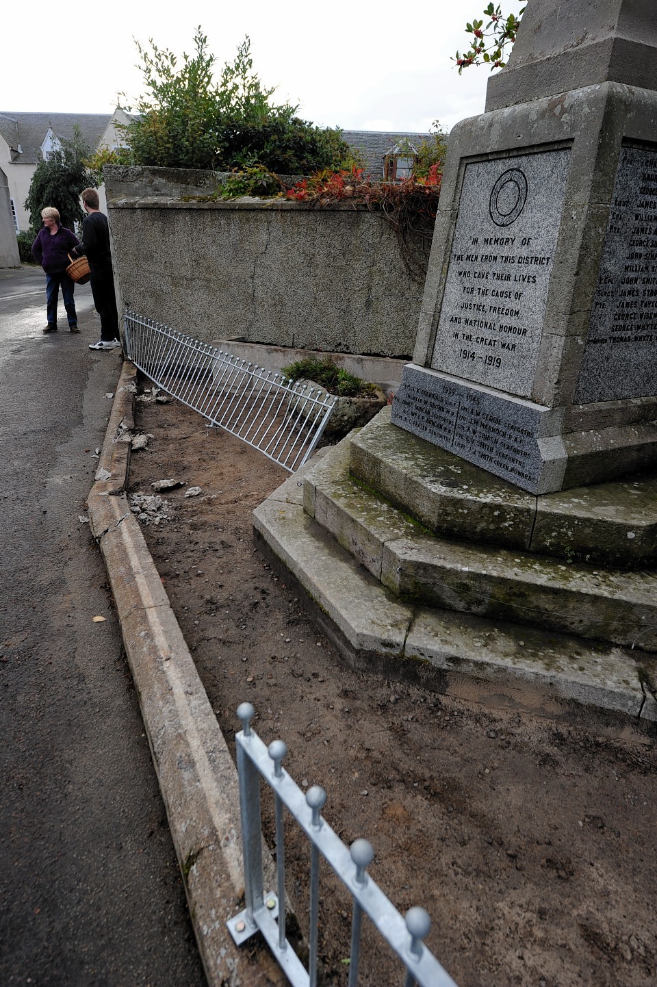 the lorry damaged this wall, railings and war memorial 