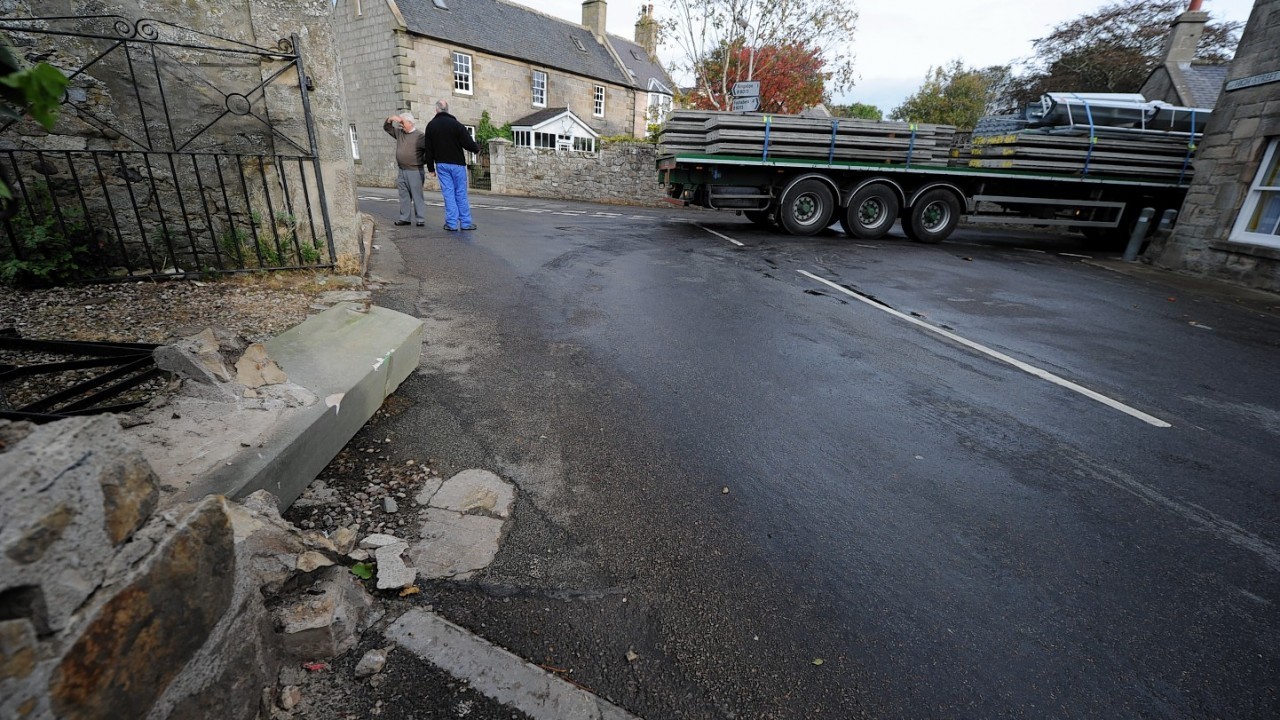 Pictures show the trail of destruction left by the lorry in the tiny village