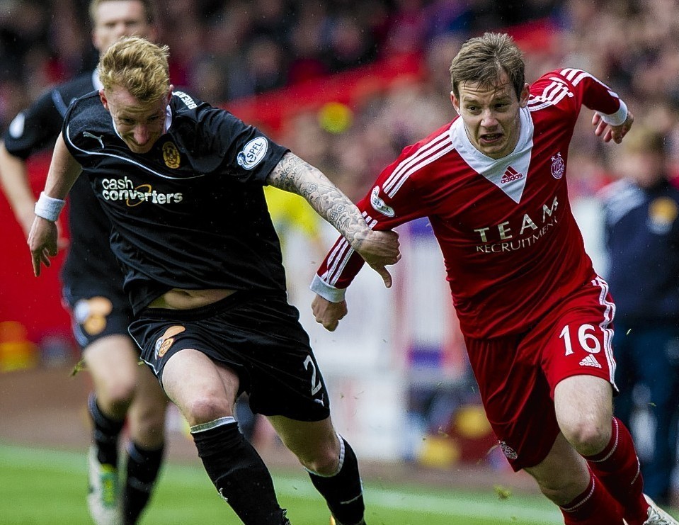 Aberdeen winger Peter Pawlett takes on  Motherwell's Craig Reid last season