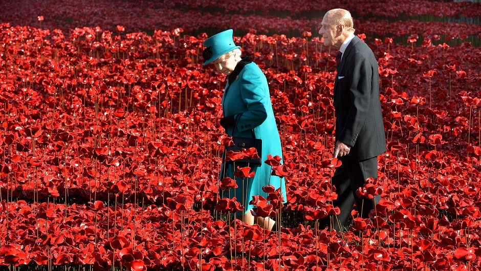 Queen Elizabeth II and the Duke of Edinburgh visit the Tower of London's Blood Swept Lands and Seas of Red installation.