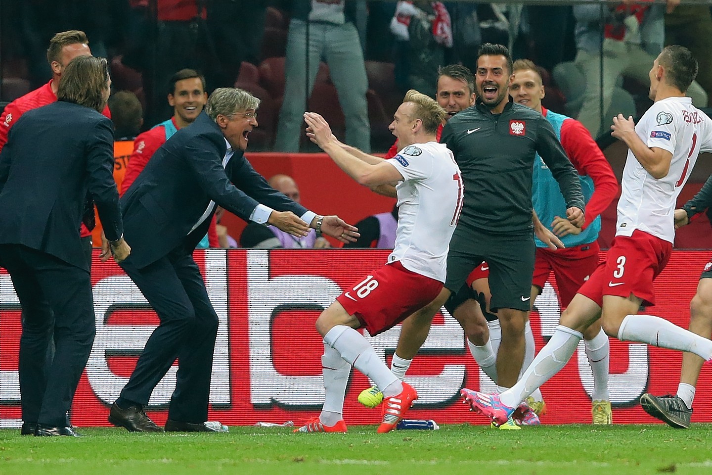 Poland celebrate their second goal against Germany on Saturday 