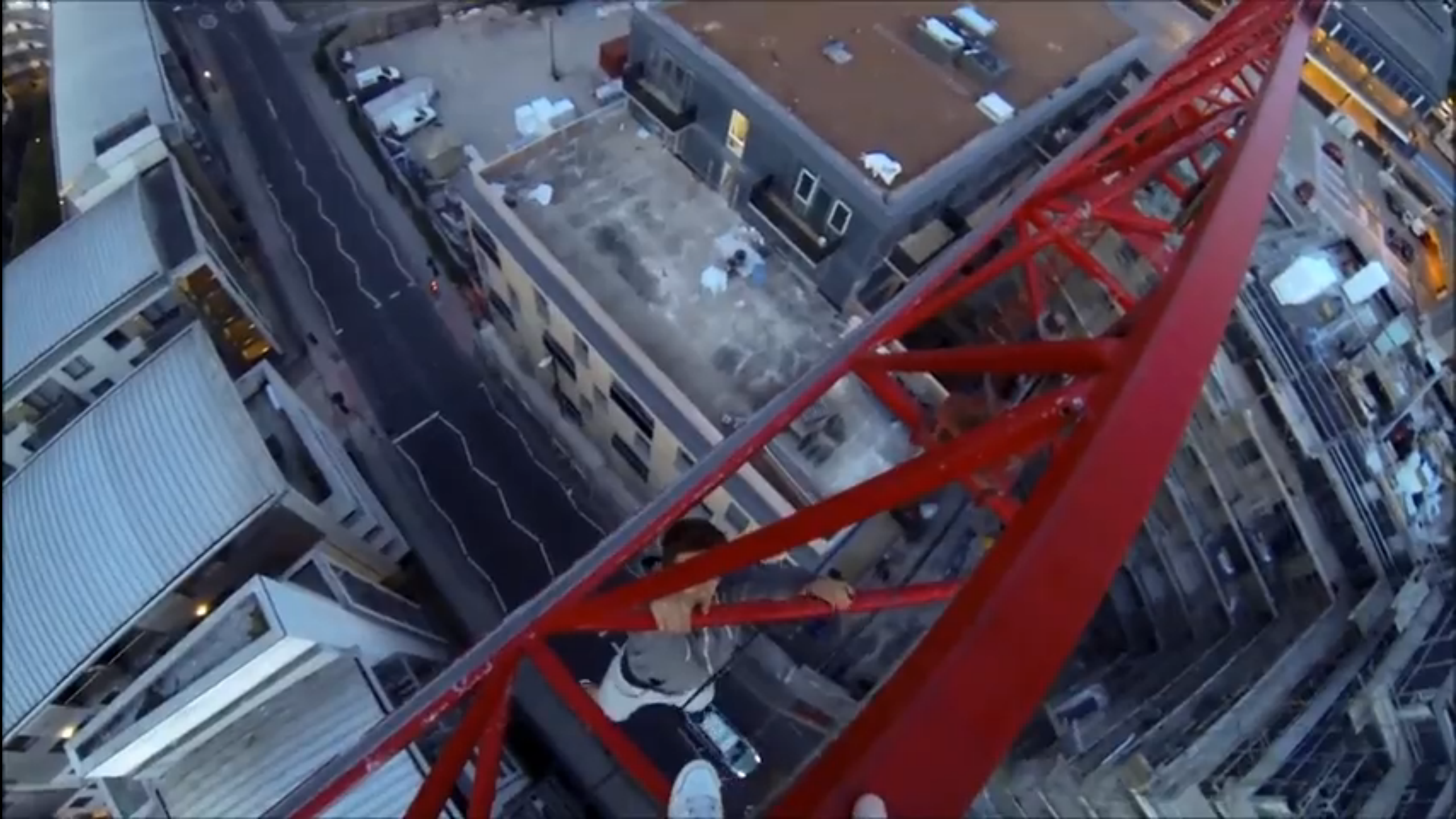 Thrill-seeking teen hangs from Brighton crane by one hand