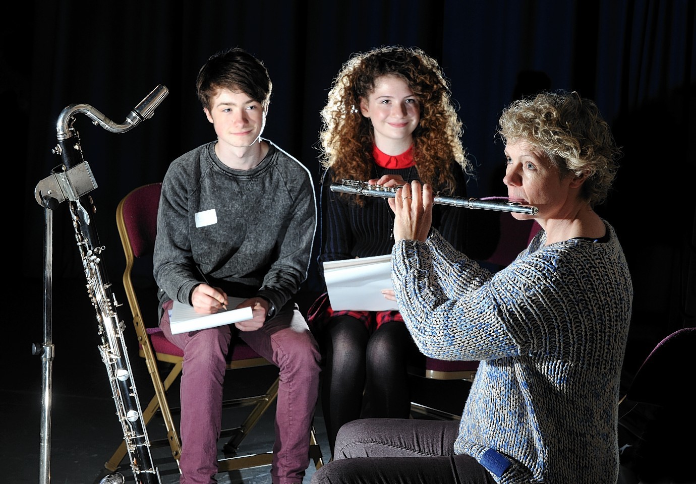 Isaac Barnes and Zakia Fawcett listening to professional musician Ruth Morley at a workshop at Woodend Barn. Youngsters from across the north-east are learning how to compose music as part of the Sound Festival.