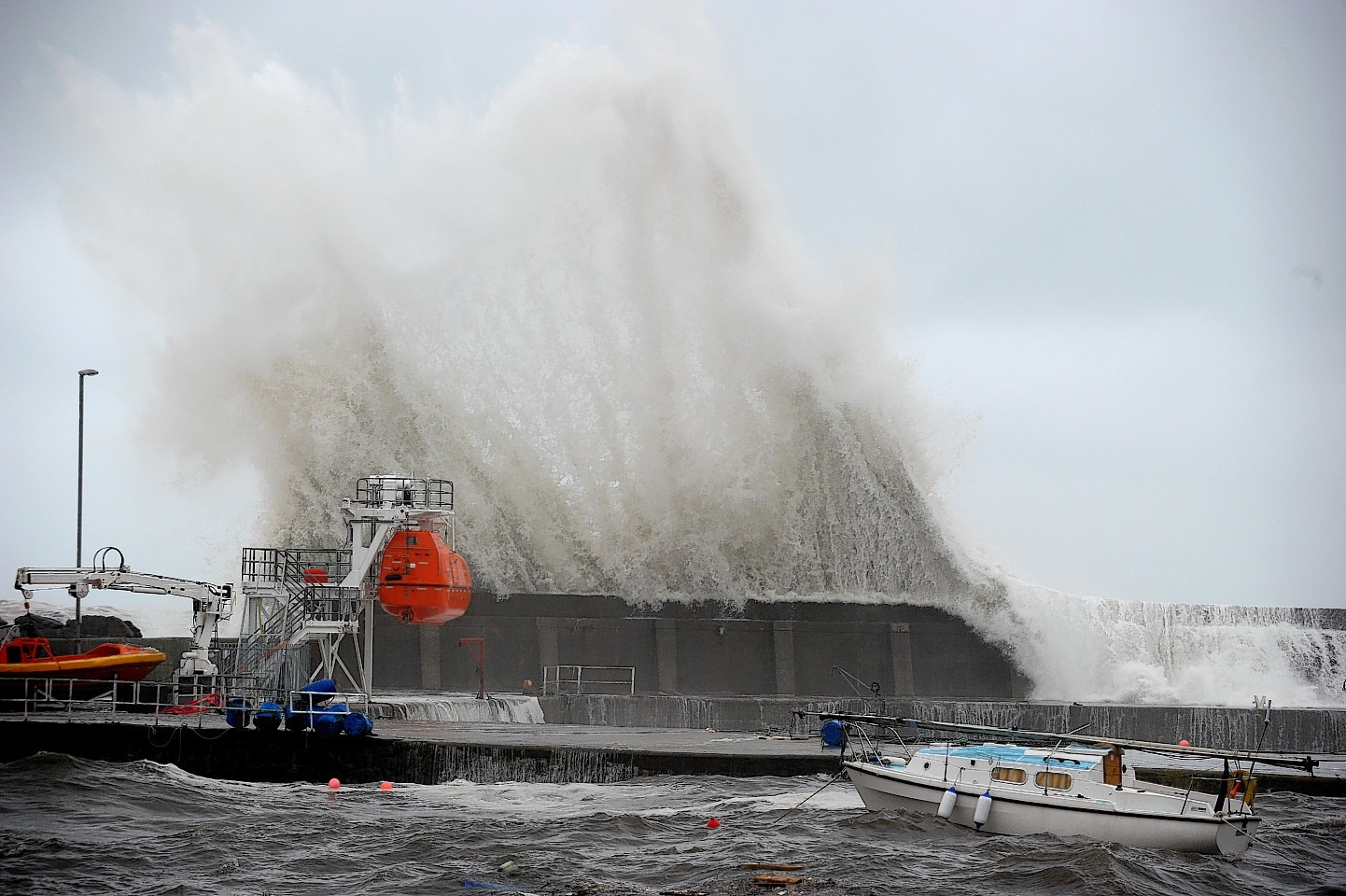 Waves batter Stonehaven Harbour wall yesterday