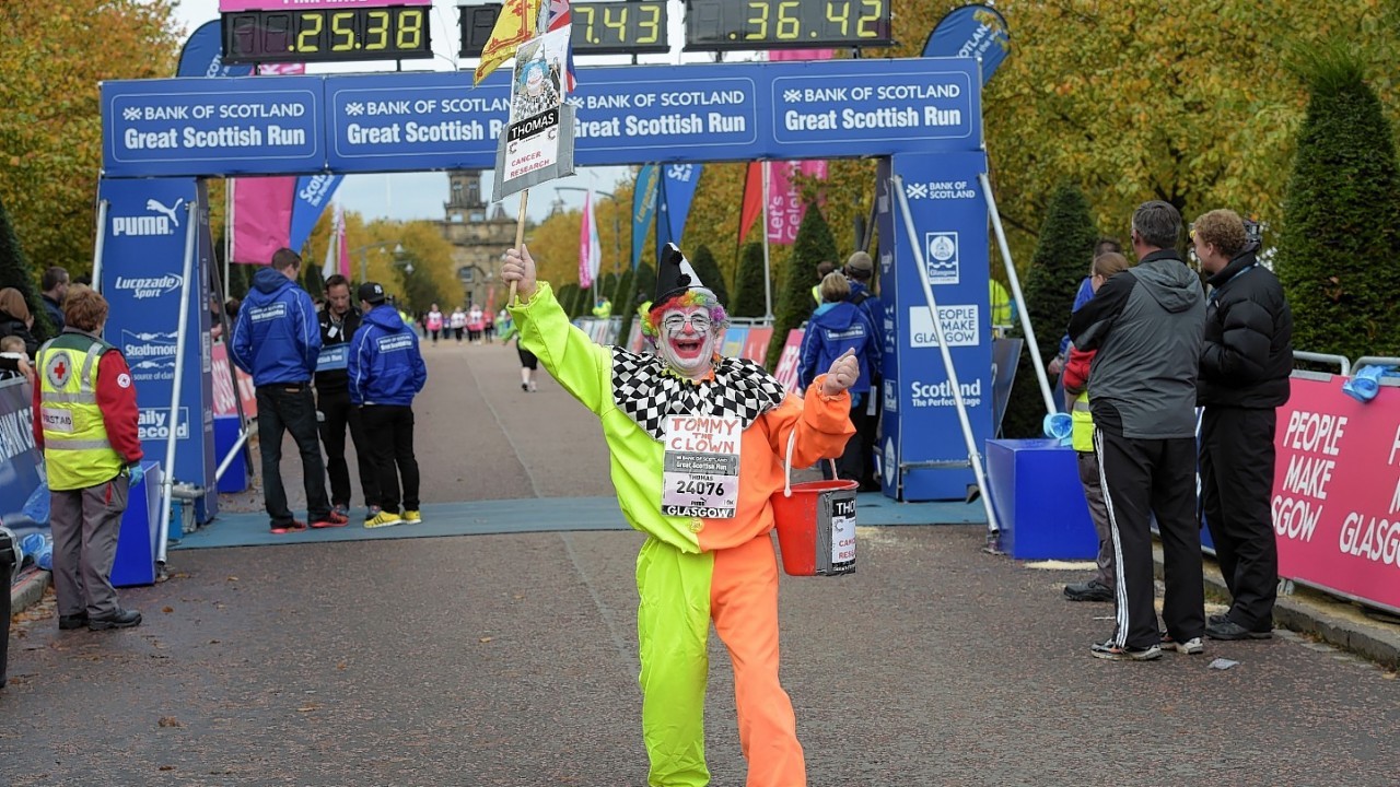 Tommy the Clown made his way round the course.