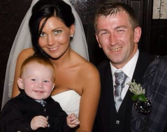Mr and Mrs Dawson with Carter on their wedding day