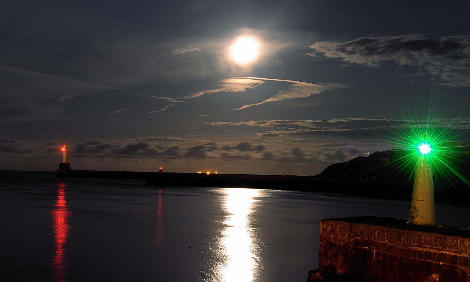 A full moon shines over Aberdeen Harbour. Photo by Colin Rennie. 