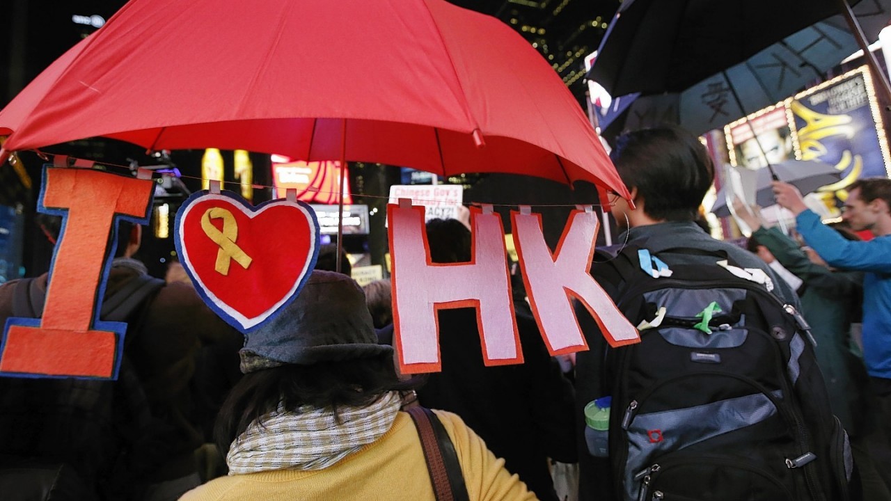 A woman shows her solidarity with Hong Kong protesters during a rally in New York's Times Square